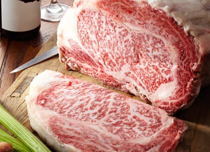 cutting ribeye steak