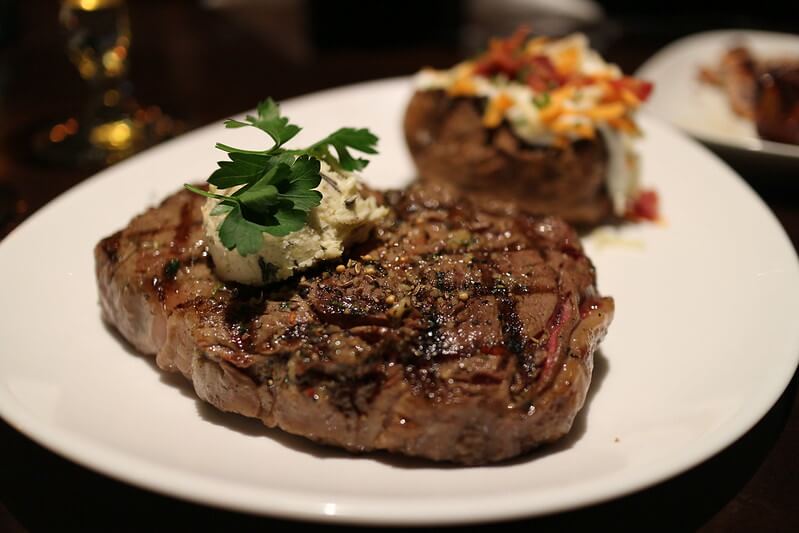 Grilled Bone-In Ribeye with Herb Butter