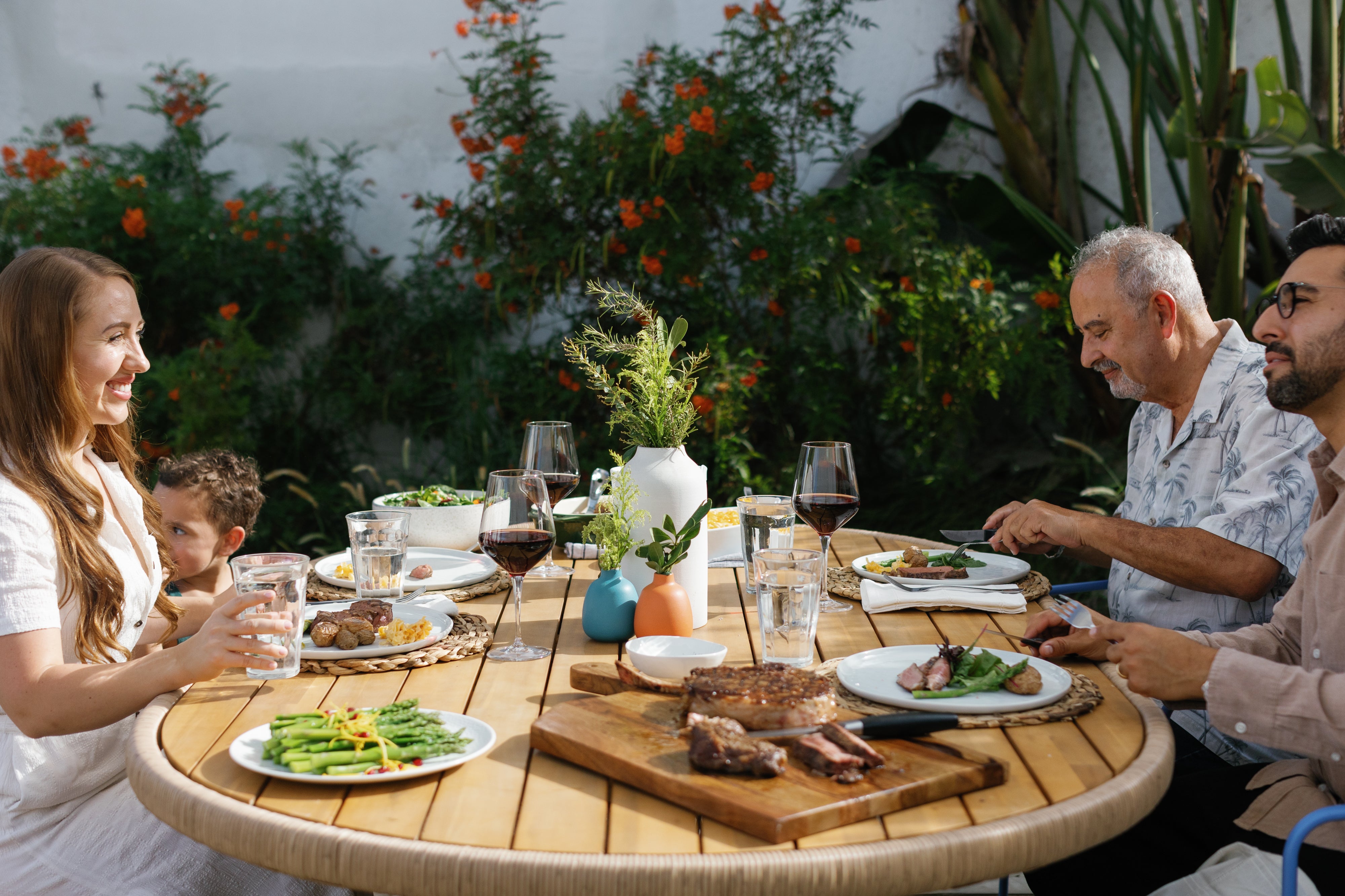 Family enjoying a steak dinner together