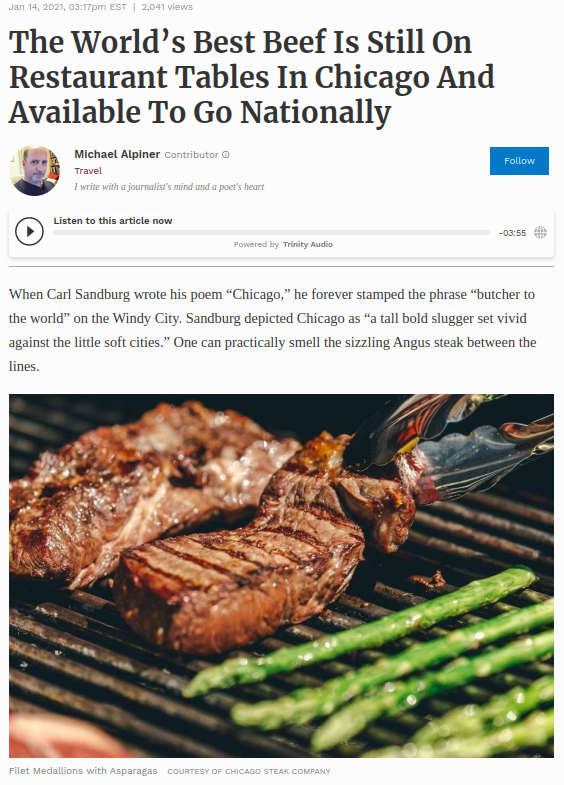 Article about Chicago beef on a restaurant table with a focus on grilled meat and asparagus.
