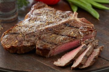 medium rare sliced porterhouse steak