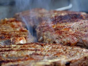 Smoked steaks cooked on a smoker