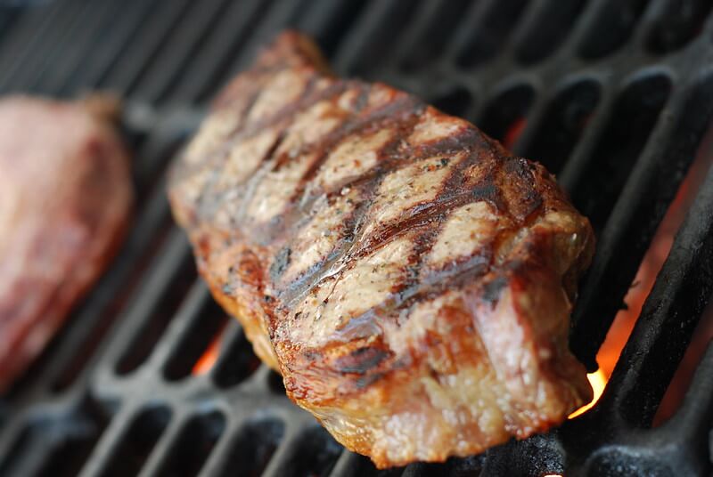 steak cooking on the grill