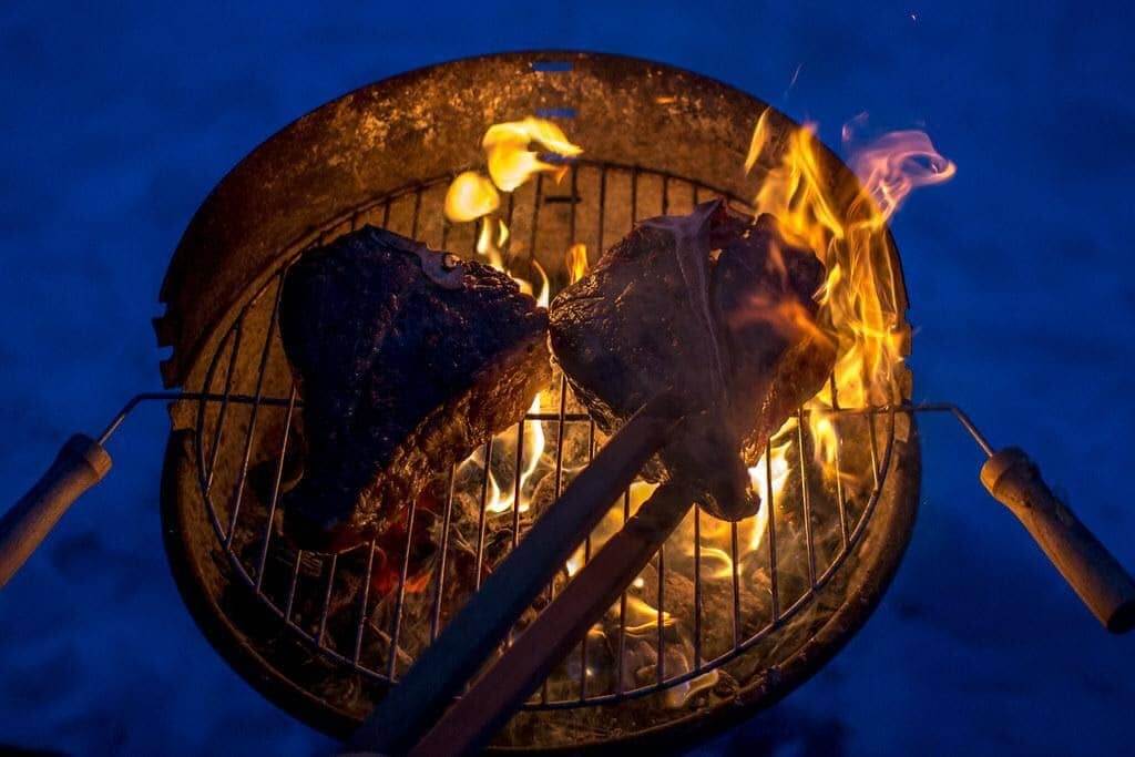 cooking porterhouse steak on the grill