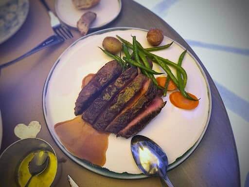 flat iron steak on platter