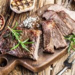 cooked ribeye steak on a platter