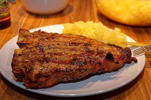 cooked t-bone steak served