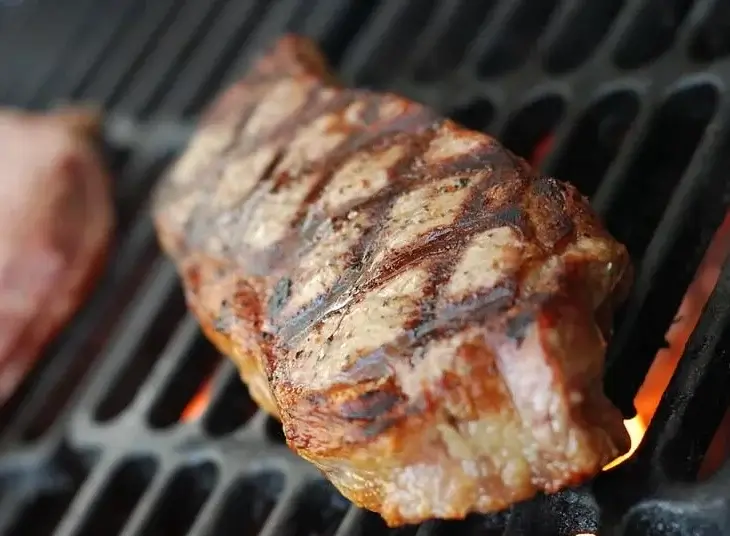 steak cooking on the grill