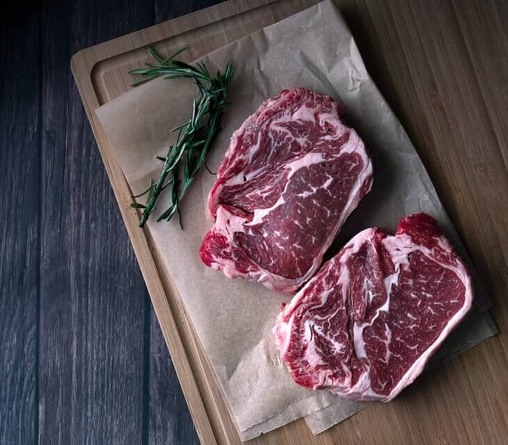chuck eye steak on cutting board