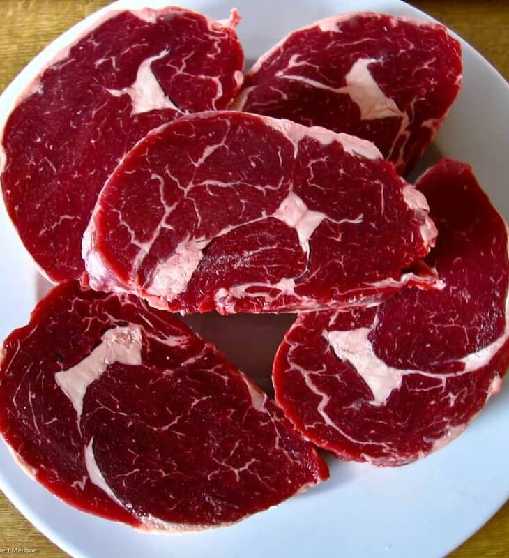 uncooked dry aged ribeye steak