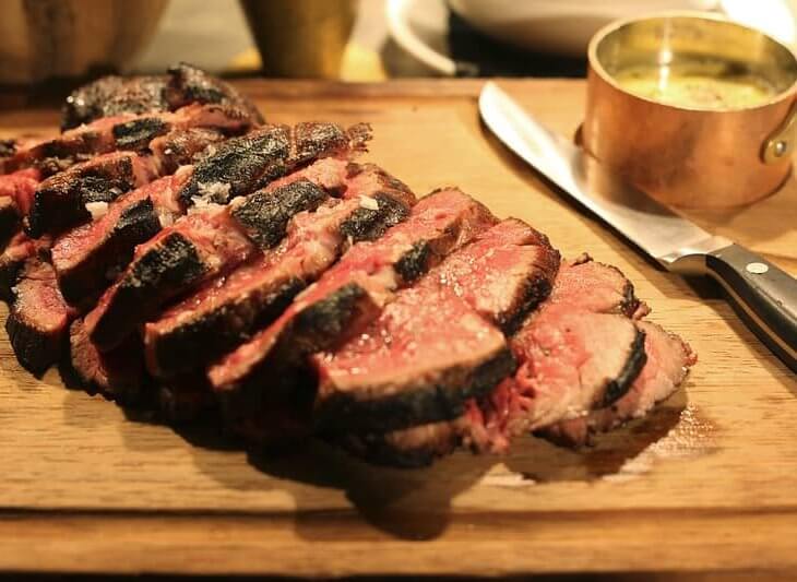 chateaubriand steak sliced and served on platter