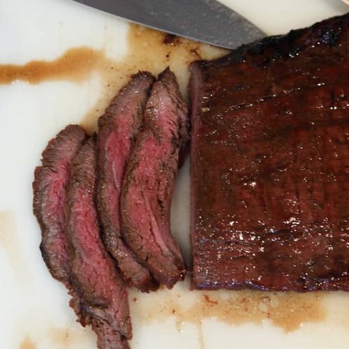 flank steak in a red wine marinade sliced