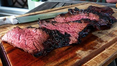 smoked flank steak cut and ready to eat