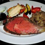 prime rib au jus sauce with rice and lobster