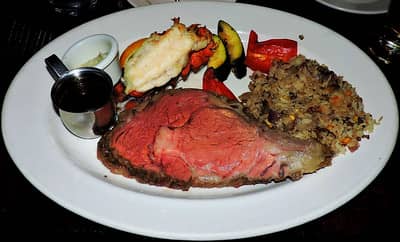 prime rib au jus sauce with rice and lobster