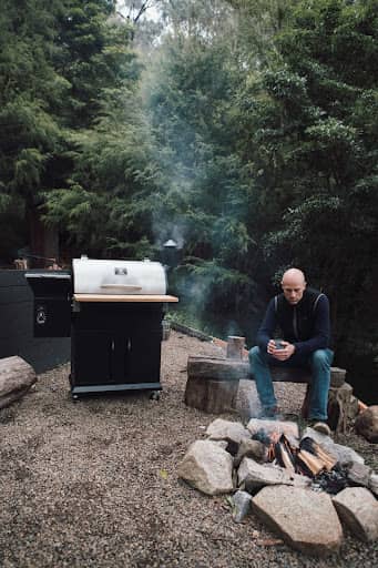 man camping making prime rib on pellet grill