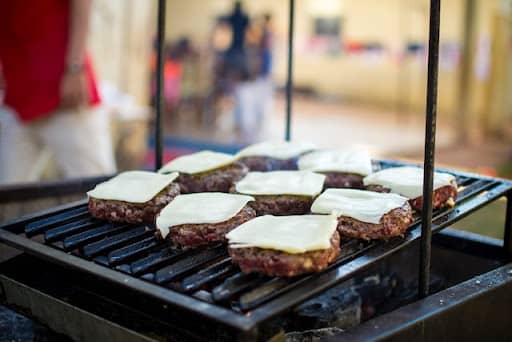 hamburger steak on the grill with cheese