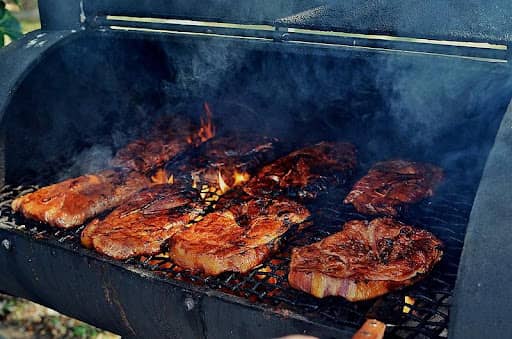 marinated pork steaks on the grill