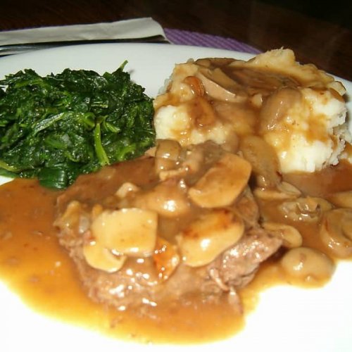 cube steak with cream of mushroom soup and gravy with mashed potatoes