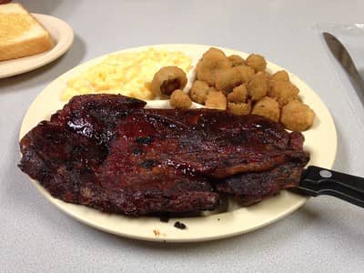 bbq pork steak served with mac and cheese