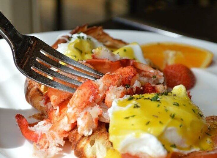 lobster served with eggs and croussant