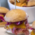 corned beef sliders with pickled cabbage slaw and cheddar cheese