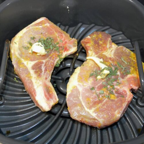 pork chops being cooked in air fryer