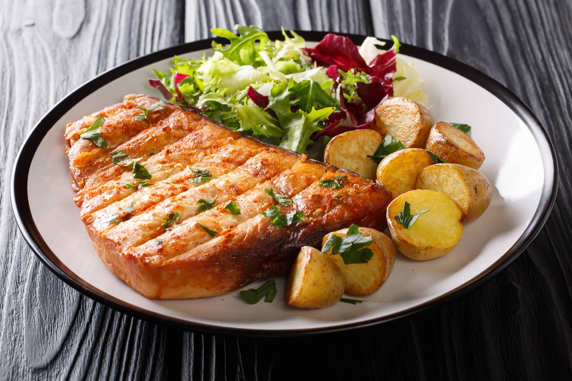 grilled swordfish with potatoes and salad
