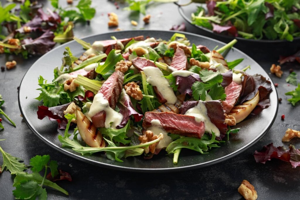 steak salad with pears, walnuts, and green vegetables